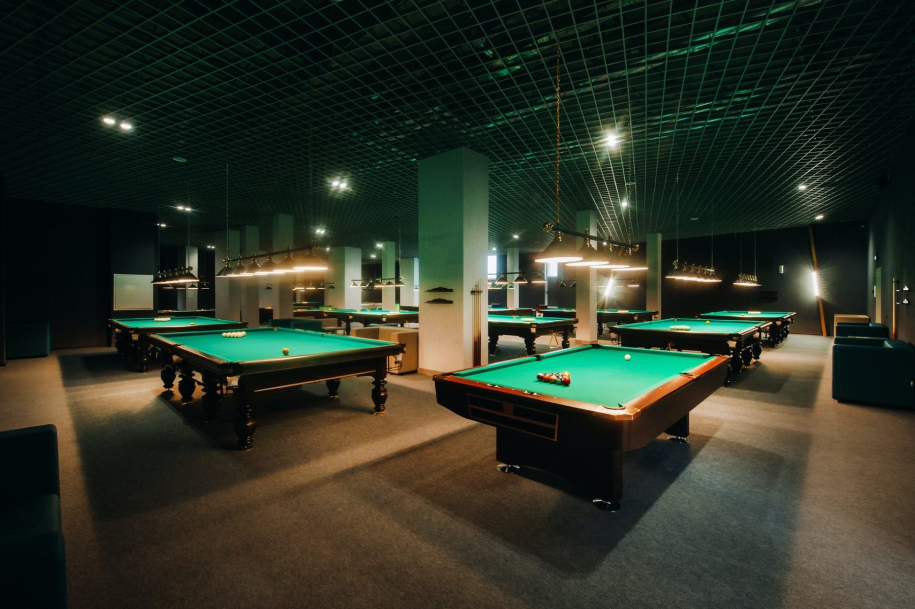 billiard-table-with-green-surface-and-balls-in-the-billiard-club-pool-game-e1640711989794.jpg